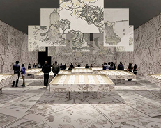 Visitors walking through a gallery where Hokusai’s drawings are projected on the walls